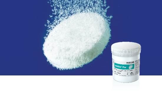 White effervescent tablet dissolving in water with bubbles, next to a container labeled 'Ecolab ActiClor Plus'